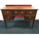 A Georgian style mahogany dressing table, the rectangular top above kneehole with fitted frieze