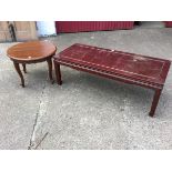 A rectangular 4ft hardwood coffee table with panelled top above moulded frieze, raised on tapering