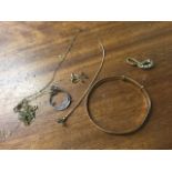 Various hallmarked 9ct gold pieces including a bangle, an old ring, pendants, fine chains, etc -