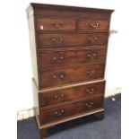 A Georgian mahogany tallboy with moulded crossbanded cornice above two short and three long