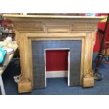 A mahogany chimneypiece with mantelpiece above moulding with fluted frieze, the frame of