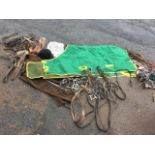 Miscellaneous horse equipment including a Westcroft outdoor rug, complete bridles, leather head