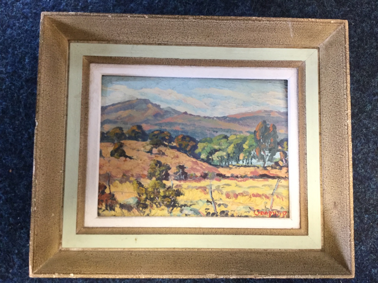 Goadwid, oil on board, landscape with trees looking over fence, signed indistinctly, framed, paper