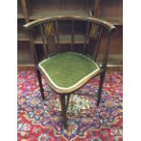 A stained Edwardian corner chair, the curved back and splats inlaid with boxwood stringing, with