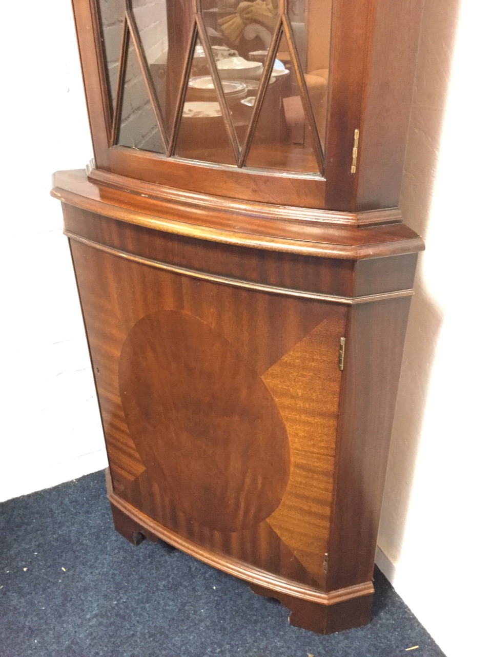 A bowfronted mahogany corner cabinet with moulded dentil cornice above an astragal glazed door - Image 2 of 3