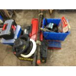Various automotive gear including a car battery, jump leads, a roof rack, empty tool boxes, an