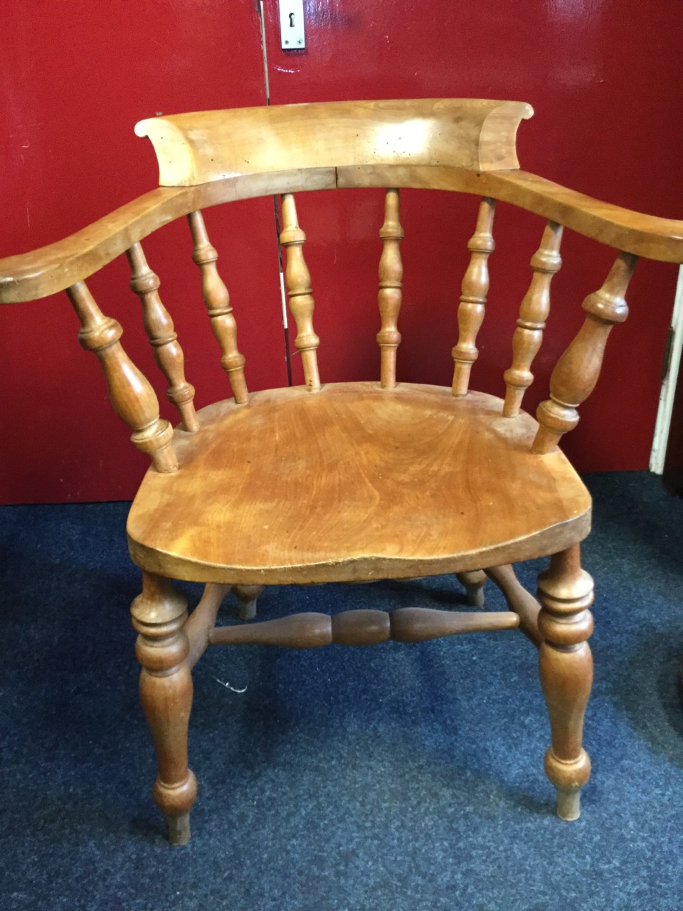 A mahogany captains chair, the shaped bow back on spindles above a solid seat, raised on turned legs - Image 2 of 3