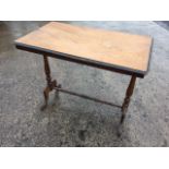 A rectangular Victorian mahogany centre table, the top with ebonised moulding raised on turned