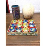 A square cloisonné vase with canted corners decorated with children and blossom foliage framed by