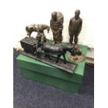 A boxed Ringtons faux bronze delivery vehicle; a coal cast model of a pit pony pulling truck; a pair