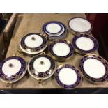 An Alfred Meakin dinner service in the Bleu de Roi pattern having blue bands decorated with