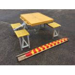 A Concord folding picnic table with four seats; and a large red & yellow striped windbreak. (2)