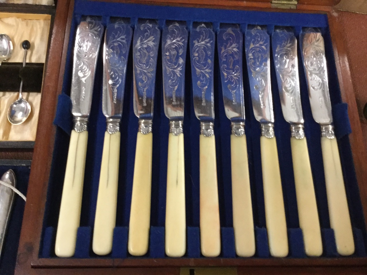 A cased set of hallmarked silver coffee spoons with shell embossed handles; another hallmarked cased - Image 2 of 3