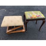 A rectangular mahogany dressing table stool with woolwork tapestry drop-in upholstered seat raised