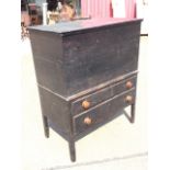 A nineteenth century oak box on stand having interior with candle shelf and compartments for two