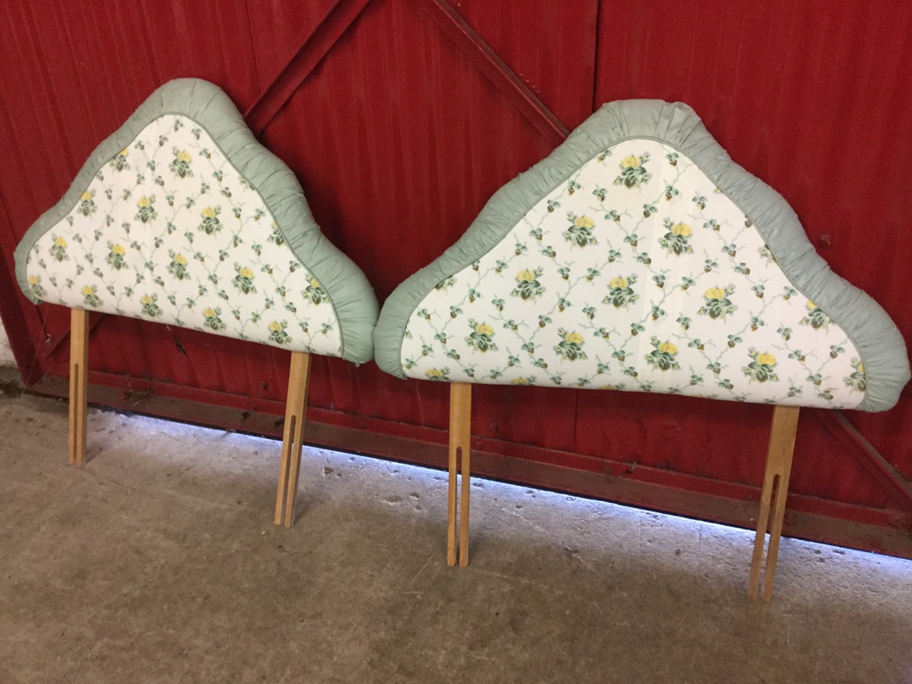 A pair of 3ft single bed arched headboards, upholstered in printed cotton with pleated borders. (