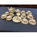 A Victorian Staffordshire part teaset including teapot & cover, decorated with green leaves and