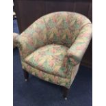 An C20th upholstered tub armchair with later leaf tapestry upholstery with copper studding, raised