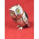 A Sterling silver novelty pin cushion modelled as an owl inlaid with glass bead eyes, the back