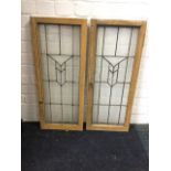 Two leaded glass doors in grained frames. (14in x 33.75in ext) (2)
