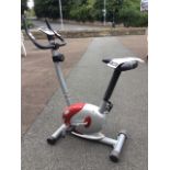 A Tesco magnetic exercise bike with handpulse, the machine with adjustable soft seat, complete