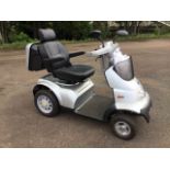 A 2014 TGA Breeze S4 mobility scooter, the grey four-wheeler with carrybox, adjustable soft seat,