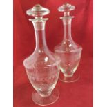 A pair of engraved vase shaped decanters & stoppers, with waisted tubular necks and circular