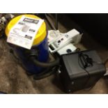 A Record RSDE1 electrical dust extractor, the tubular bin attached to flexible pipe, with