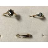 A 9ct gold ring claw set with teardrop shaped dark stone; another 9ct gold ring set with small