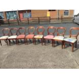 A married set of eight Victorian mahogany balloon back dining chairs, all with drop-in upholstered
