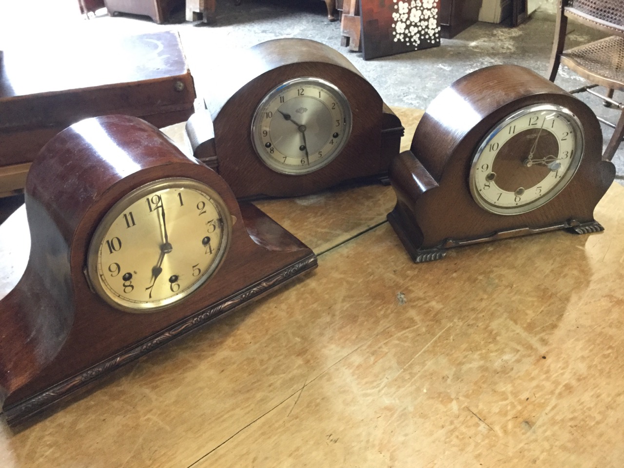 A 30s oak cased Smiths Enfield mantle clock with silvered chapter ring under convex glass; another