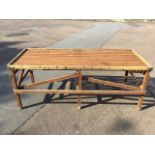 A rectangular garden potting table, with slatted tray top on square column legs. (81in x 32.75in x