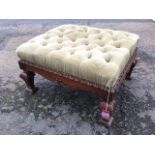 A carved rectangular button upholstered stool, the chisel carved frame with acanthus scrolled aprons