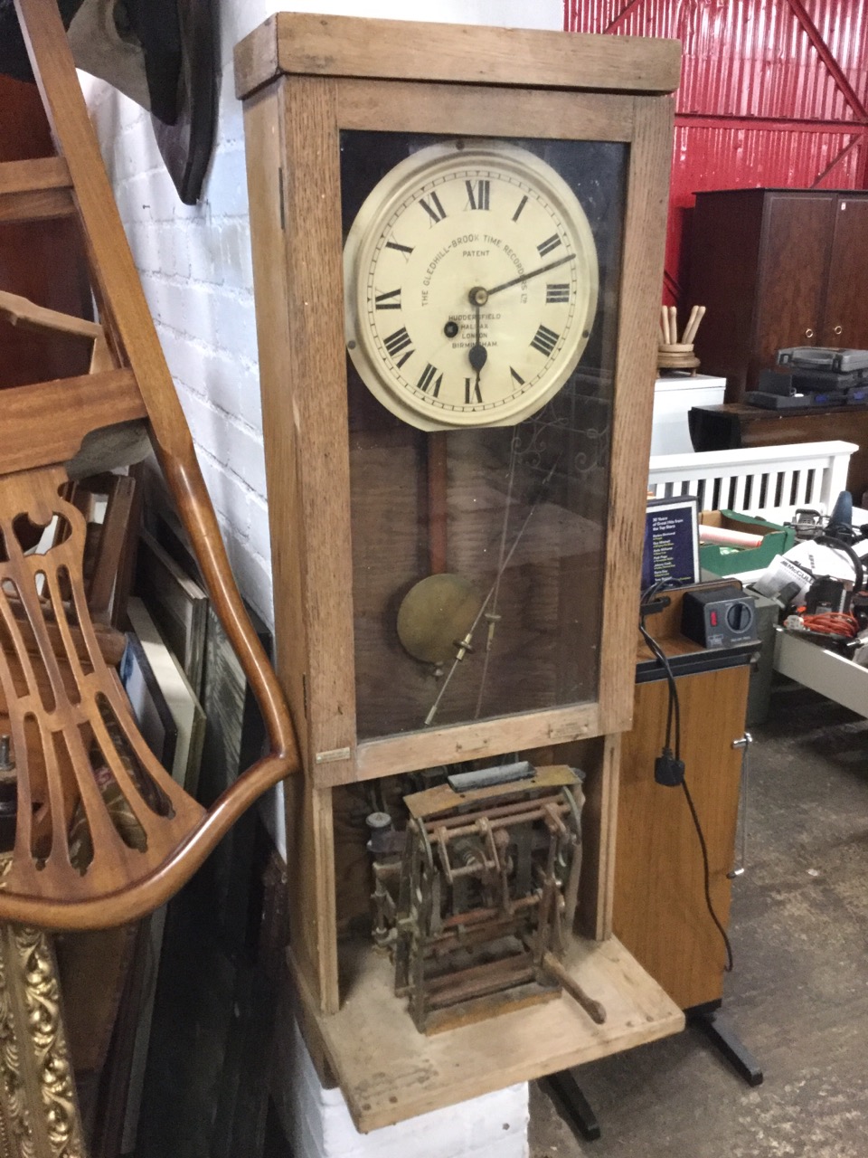 An oak cased time recording clock by The Gledhill-Brook Time Recorders Ltd, the dial with roman