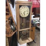 An oak cased time recording clock by The Gledhill-Brook Time Recorders Ltd, the dial with roman