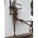 Lorna Logan, a wrought iron figural sculpture, the robotic-like man made from agricultural tools and