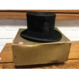A boxed silk top hat by Leonards of London, Liverpool & Newcastle - the leather band 7.5in x 6.25in.