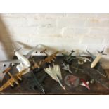A collection of model aeroplanes - several desktop models on stands including an A380 Airbus, war