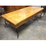 A rectangular pine coffee table, the cleated moulded top above frieze with two side drawers,