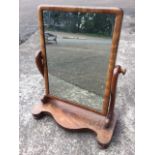 A Victorian mahogany dressing table mirror, the rectangular plate in cushion moulded frame with