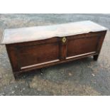 A seventeenth century oak sword chest or six plank coffer, the rectangular moulded top with band