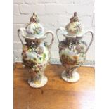 A pair of nineteenth century Staffordshire Coalport style vases and covers, heavily encrusted with