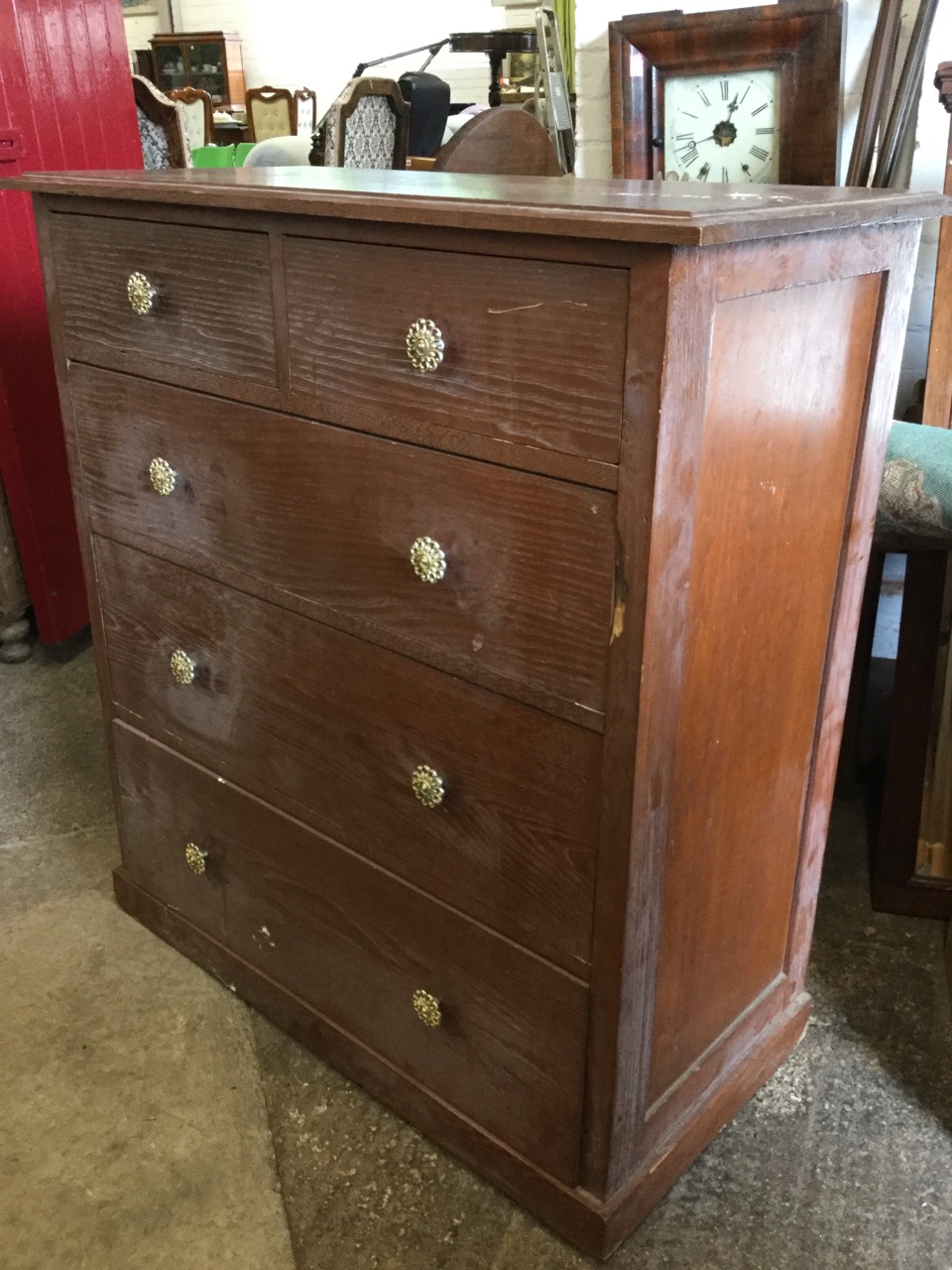 A late Victorian oak chest of drawers, with moulded top above two short and three long graduated