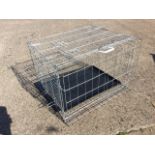A folding galvanised dog cage with hinged doors and interior tray. (30in x 24.5in x 20.75in)