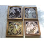 A set of four tube-lined art nouveau style gilt framed tiles emblematic of the seasons, with
