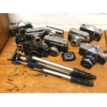 Eight 35mm cameras - Yashica, Kowa, Ricoh, Fujica, Arette, etc; a telescopic camera tripod, a
