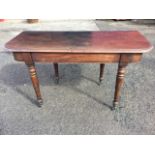 A nineteenth century mahogany dining table end, currently used as a side/hall table, with rounded