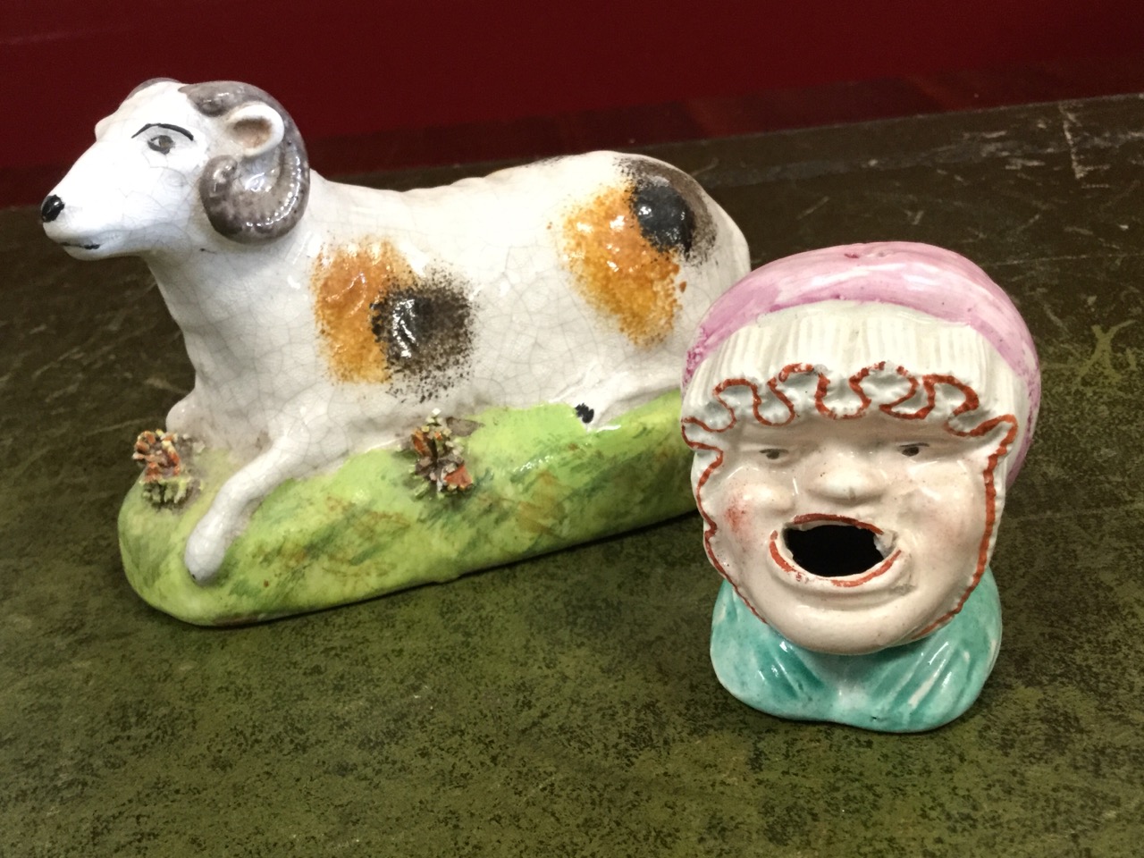 An early nineteenth century Staffordshire ram on rectangular rounded naturalistic base with