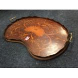 A kidney shaped Victorian mahogany tray with scalloped gallery and brass handles, the panel with