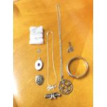 Miscellaneous silver jewellery including an oval locket mounted with an amethyst, fine chains, an